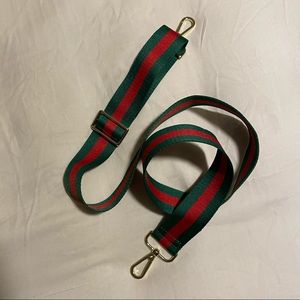 Green and red stripe bag strap